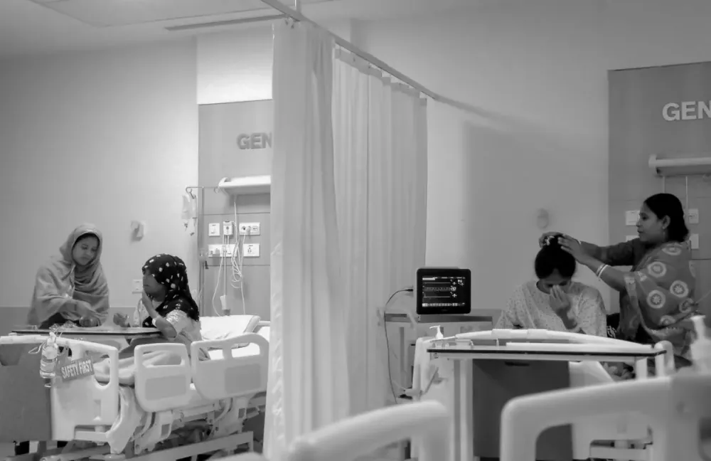 Staff caring for patients in a hospital room