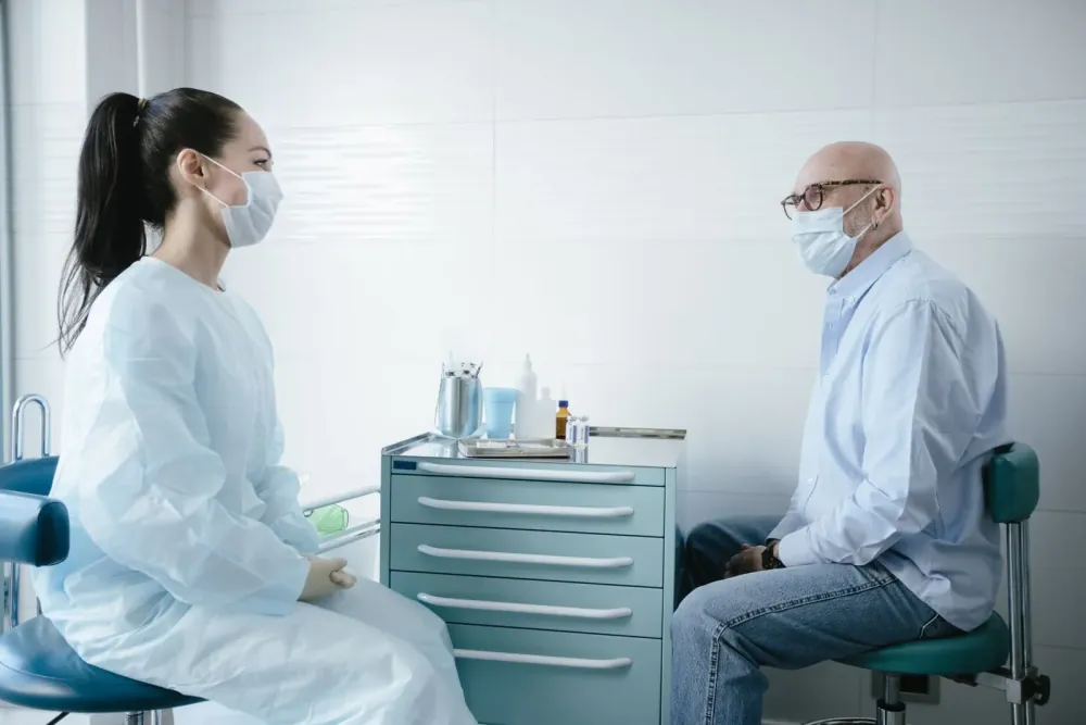 A patient discussing their concerns with a doctor