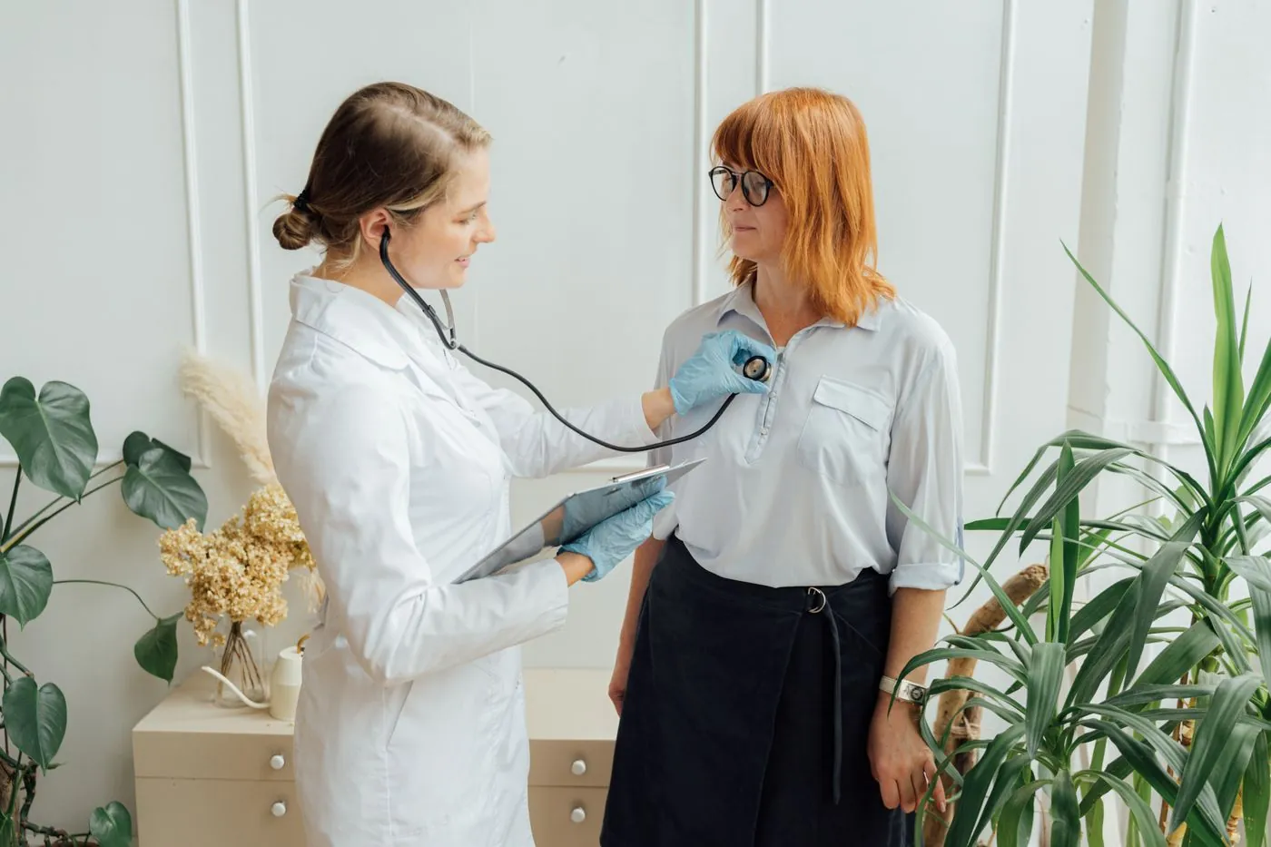 A doctor examining a patient during a routine health checkup